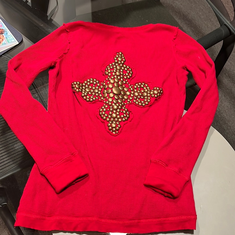 Red long sleeve T-shirt with nail heads in the back